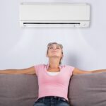 How much does an air conditioner consume if it runs for eight hours a day?