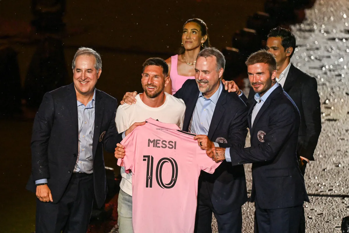103689453-topshot-argentine-soccer-star-lionel-messi-2nd-l-is-presented-by-from-r-owners-of-in.jpg