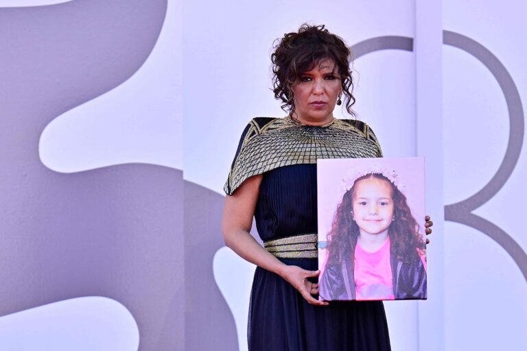 112214536-tunisian-director-kaouther-ben-hania-holds-a-portrait-of-late-palestinian-girl-hind-rajab.jpeg