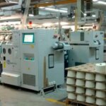 A well-known company lays off employees and closes a production line