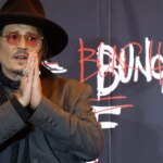 Johnny Depp is showing off his messy art for the first time in Tokyo, at the world premiere of his film “A Bunch of Stuff.”