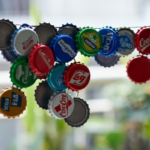 Why do they recommend hanging bottle caps in the garden?