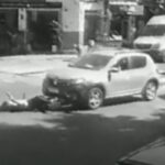 A cyclist was run over and was rescued by neighbors after she was left under the car