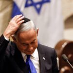 101614205-israeli-prime-minister-designate-benjamin-netanyahu-adjusts-his-skull-cap-after-speaki.jpg