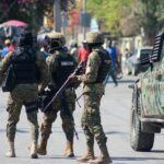 106186174-topshot-haitian-police-officers-deploy-in-port-au-prince-haiti-on-march-9-2024-spora.jpg