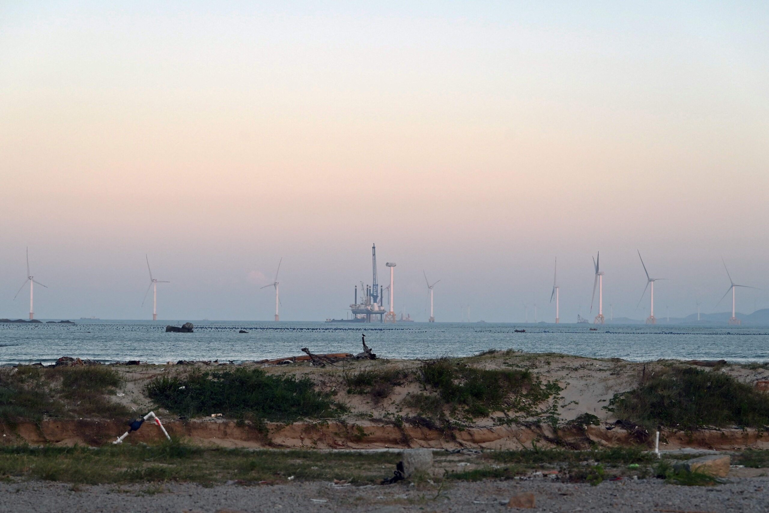 108804126-wind-turbines-are-seen-from-a-beach-on-pingtan-island-the-closest-point-in-china-to-taiwan.jpeg