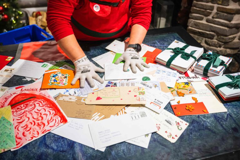109278174-a-post-elf-shows-letters-that-were-sent-to-santa-claus-from-all-over-the-world-at-santa-cl.jpeg