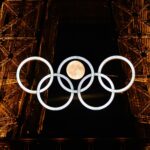 109334693-topshot-afp-pictures-of-the-year-2024-the-moon-rises-behind-the-olympic-rings-dis.jpg