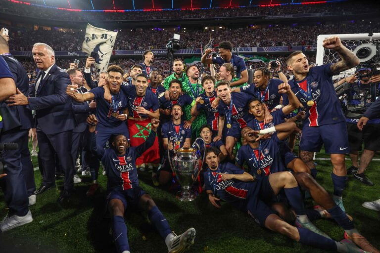 111252545-topshot-paris-saint-germains-players-celebrate-with-the-trophy-after-winning-the-uefa-c.jp_.jpeg