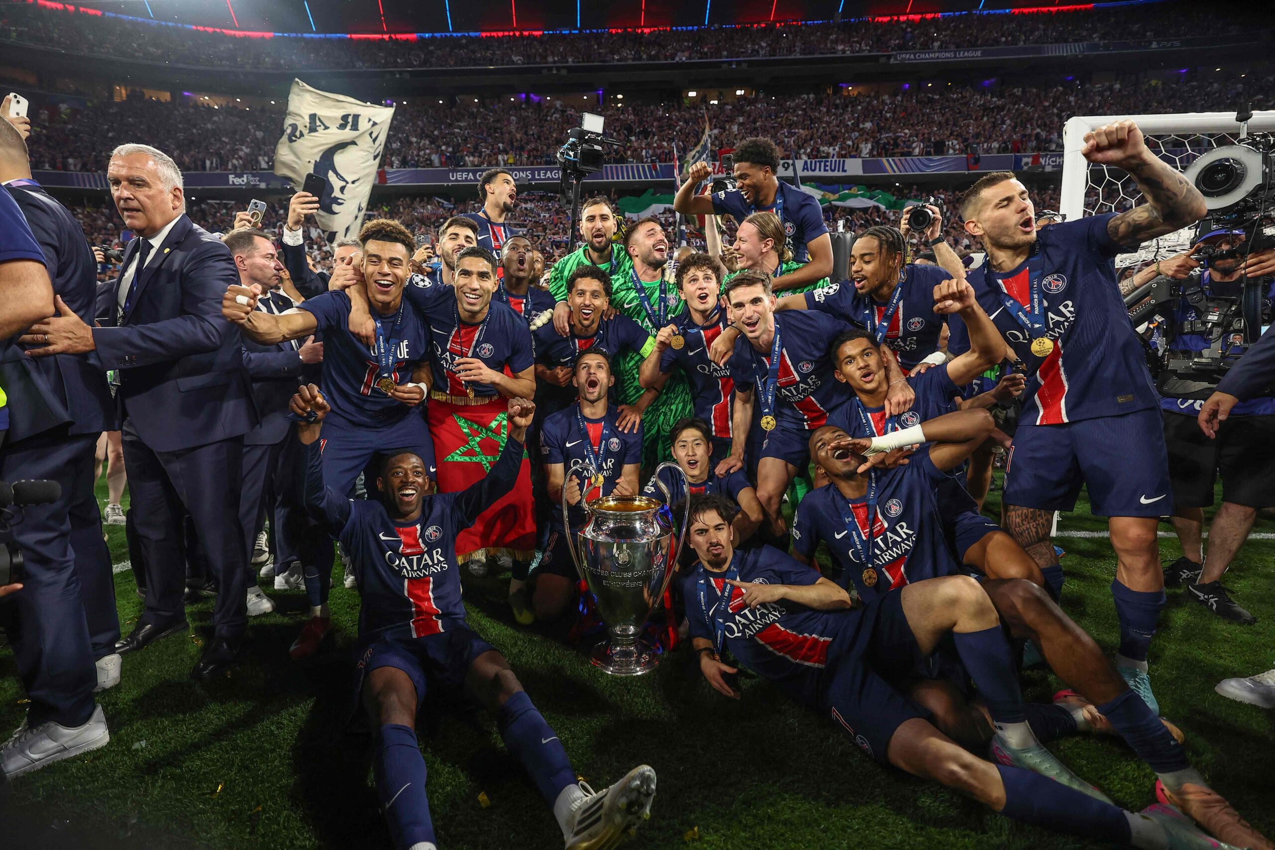 111252545-topshot-paris-saint-germains-players-celebrate-with-the-trophy-after-winning-the-uefa-c.jp_.jpeg