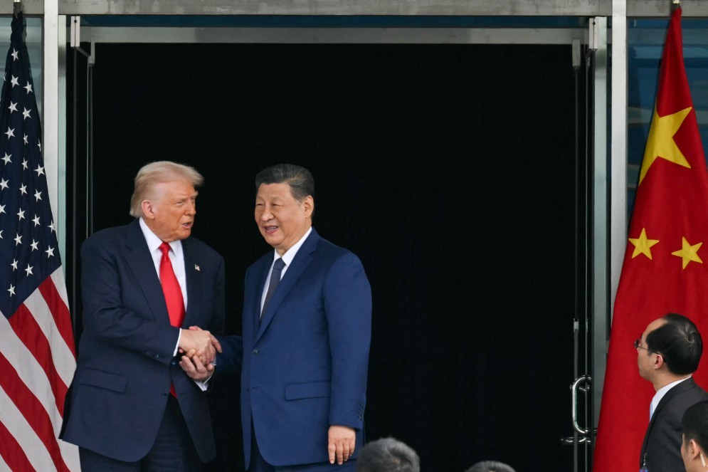 112860795-us-president-donald-trump-l-and-chinas-president-xi-jinping-shake-hands-as-they-leave.jpg