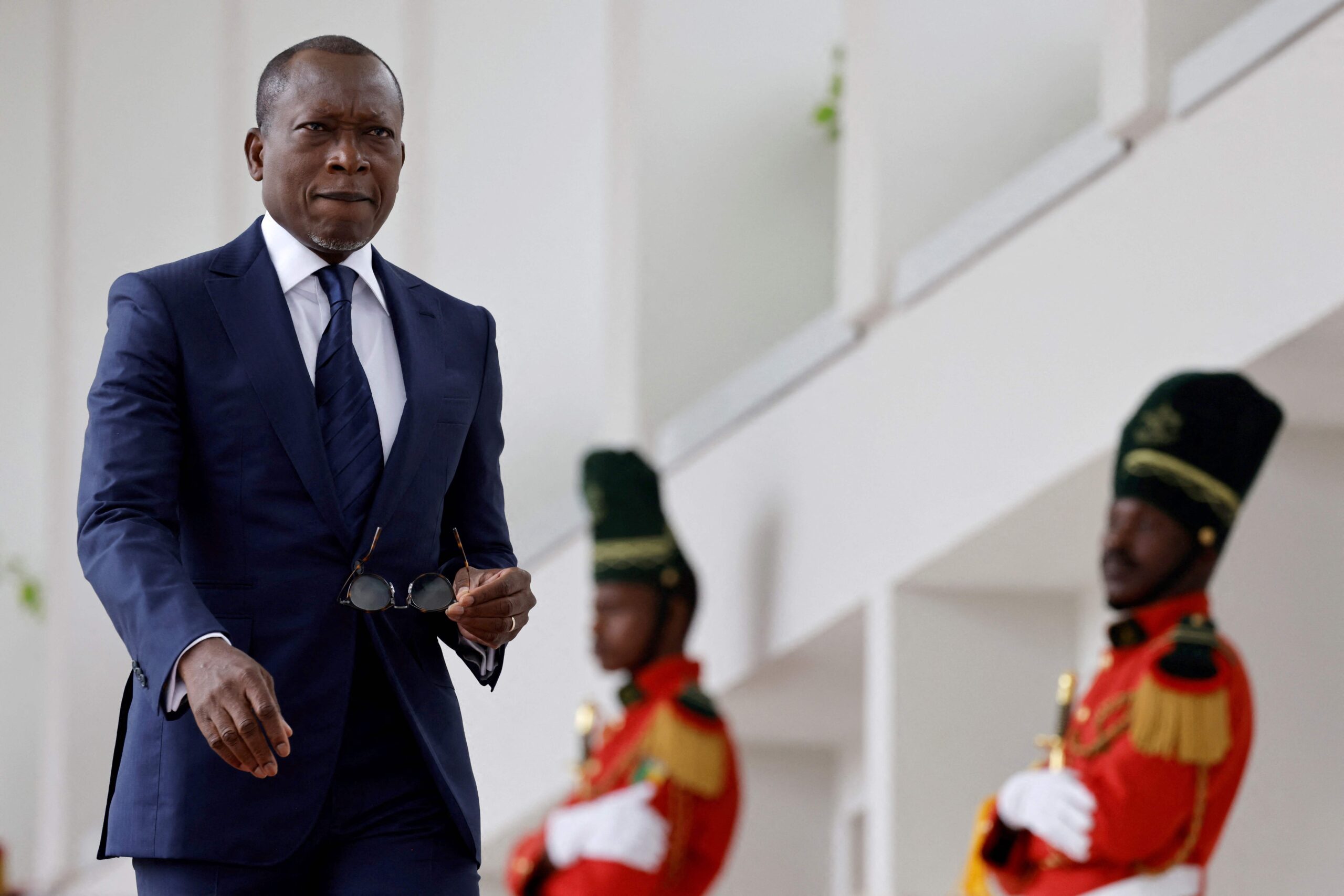113241457-files-benins-president-patrice-talon-waits-the-arrival-of-french-president-at-the-marina.j.jpeg