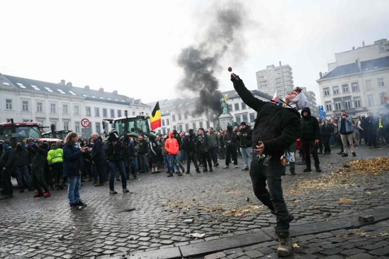 113338058-a-farmer-throws-a-potato-near-the-european-parliament-during-a-farmers-protest-to-den.jpg