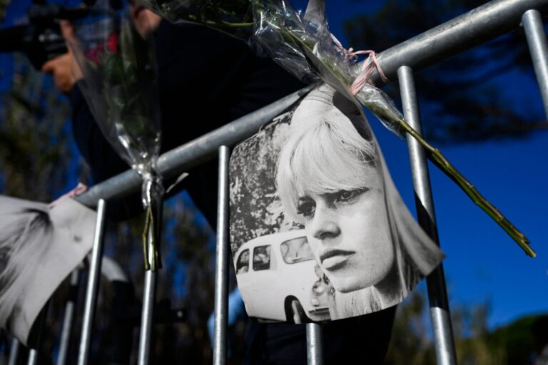 113401134-topshot-portraits-of-late-french-actress-brigitte-bardot-and-flowers-are-displayed-o.jpg