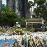 The number of people arrested for skyscraper fires in Hong Kong has risen to 13