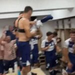 Lobo players celebrate in the locker room