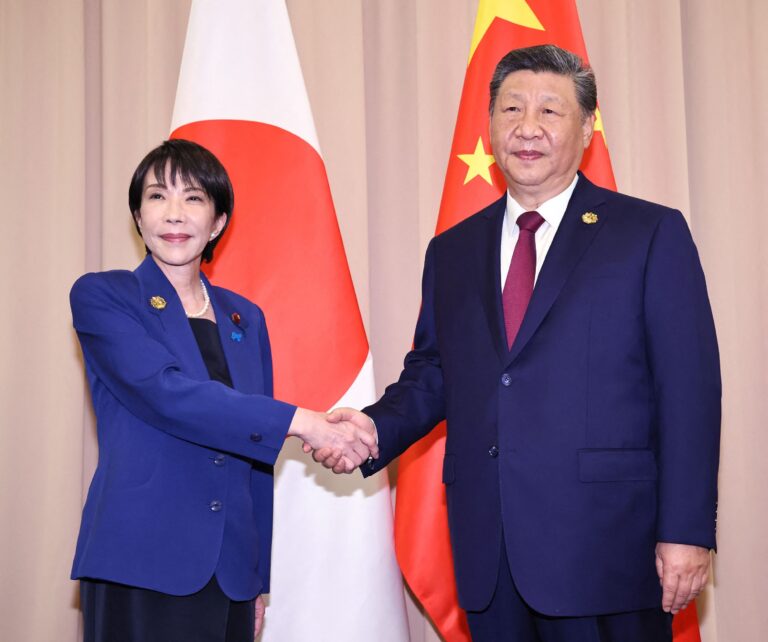 1765158575_112872556-japans-prime-minister-sanae-takaichi-l-shakes-hands-with-chinese-president-xi-jinping-ahe.jpeg