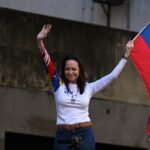 1765338791_afp-20250109-36tf4bk-v2-preview-topshotvenezuelaoppositionprotestmachado.jpg