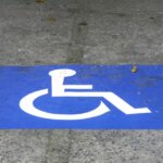 264308586-blue-handicap-parking-car-sign-outdoors-disabled1.jpg