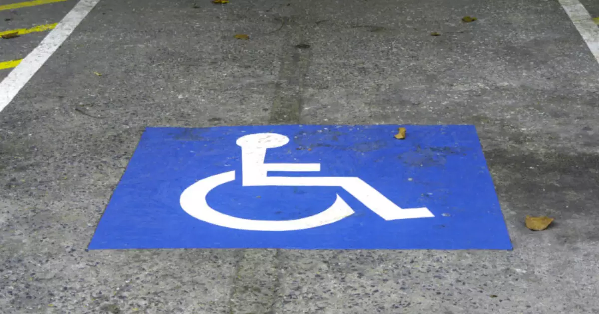 264308586-blue-handicap-parking-car-sign-outdoors-disabled1.jpg