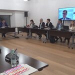 Ella attends a government meeting to monitor African swine fever coming from Mexico