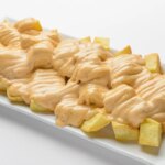 This bar advertises 100k of free bravas and is expected to overflow