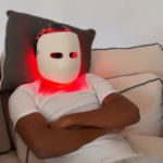 With a mask on his face and a red LED light watching the 2026 World Cup draw