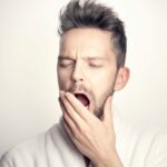 According to psychology, what does it mean to yawn without being sleepy?