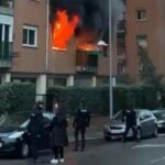 An explosion caused a massive fire in a Toledo apartment building and smoke trapped many people on the upper floors