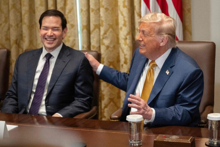 111671393-us-president-donald-trump-pats-secretary-of-state-marco-rubio-on-the-shoulder-during-a-cab.jpeg